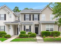 Charming townhouse featuring neutral siding, black shutters, and manicured landscaping for inviting curb appeal at 333 Flyway Rd, Goose Creek, SC 29445