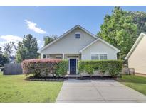 Charming single-story home with a well-manicured lawn and inviting front entrance at 469 Hainsworth Dr, Charleston, SC 29414