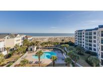 Beautiful aerial view of beachside community with a pool and ocean views from the condos at 509 Summerhouse, Isle of Palms, SC 29451