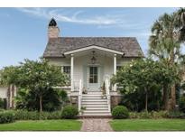Charming front entrance featuring a brick walkway and stairs leading to a quaint porch at 926 Pitt St, Mount Pleasant, SC 29464