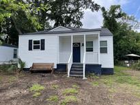 Charming one-story home with a covered porch and a classic white facade at 2327 Bailey Dr, North Charleston, SC 29405