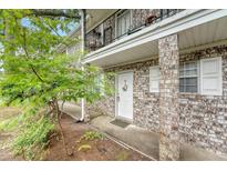 Welcoming front entrance with brick facade, covered walkway, and well-maintained landscaping at 516 Arlington Dr # B4, Charleston, SC 29414