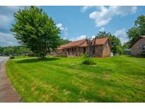 Charming brick home with a well-maintained front yard and mature trees and convenient ramp at 107 Salina Ln, Goose Creek, SC 29445