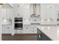 Well-lit modern kitchen featuring white cabinets, stainless steel appliances, and stylish countertops at 1427 Dahlia Rd, Mount Pleasant, SC 29464