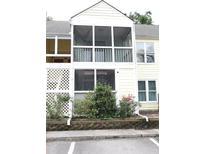 Two-story screened porch overlooking well-maintained landscaping and providing outdoor living space at 403 Sunny Side Way, Summerville, SC 29485