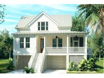 Inviting two-story home boasts a metal roof, covered front porch, and a beautifully landscaped yard with native palm trees at 5005 Saltspray Ln, Johns Island, SC 29455