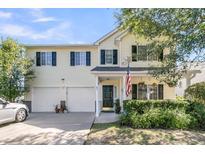 Charming two-story home featuring a two-car garage, well-kept landscaping, and an inviting front porch at 67 Regency Oaks Dr, Summerville, SC 29485