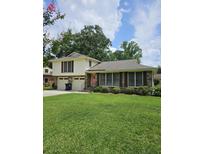 Charming two-story home with a well-manicured lawn, brick facade, and attached two-car garage at 101 Brittany Ct, Summerville, SC 29485