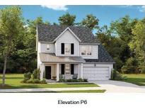 Charming two-story home with white siding, black shutters, and a welcoming front porch at 112 Orchard Blossom Ln, Summerville, SC 29485