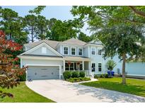 Charming two-story home with a well-maintained front yard and inviting covered porch at 1164 Sharpestowne Ct, Mount Pleasant, SC 29466