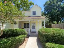 Charming cottage-style home featuring a welcoming front porch and mature landscaping at 1211 Meadow Park Ln # B, Mount Pleasant, SC 29464