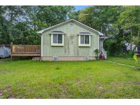 Charming bungalow style home featuring a quaint front porch and well-maintained lawn and landscape at 2702 Decatur St, North Charleston, SC 29405