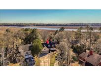 Wonderful waterfront property with gorgeous views and mature trees provides a quiet setting at 316 Anadale Ct, North Charleston, SC 29418
