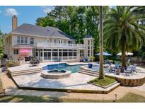 Beautiful backyard features a pool, spa, and patio, perfect for outdoor entertaining at 3685 Colonel Vanderhorst Cir, Mount Pleasant, SC 29466