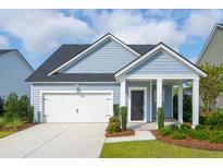 Charming single-story home featuring a one-car garage, light blue siding, and a covered entryway at 115 Moscato Ln, Summerville, SC 29485