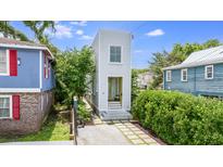 Unique narrow home with a quaint entrance and fresh landscaping in a charming neighborhood at 29 Hanover St, Charleston, SC 29403