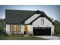 Charming new home featuring a two-car garage, stone accents, and a welcoming front porch at 3006 Abagail Ct, North Charleston, SC 29406