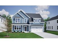 Charming two-story home featuring blue siding, a welcoming front porch, and an attached two-car garage at 3033 Seaton Street, Summerville, SC 29486