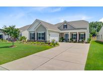 Charming single-story home with manicured lawn and welcoming front porch at 366 Tupelo Lake Dr, Summerville, SC 29486