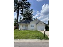 Charming single-story home with well-maintained lawn and attached one-car garage at 419 Courtland Dr, Summerville, SC 29486