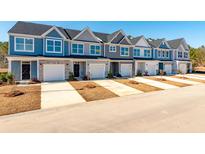 New townhomes feature craftsman style elevations, private garages, and inviting curb appeal at 420 Duskywing Dr, Goose Creek, SC 29445