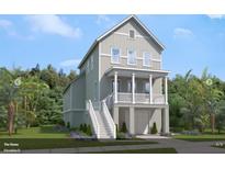 Charming two-story home with a welcoming porch and a well-maintained, landscaped yard at 617 Du Bois Dr, Johns Island, SC 29455