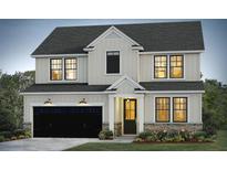 Charming two-story home featuring a black garage door, white siding, and stone accents for a cozy curb appeal at 8609 Connor Ct, North Charleston, SC 29406