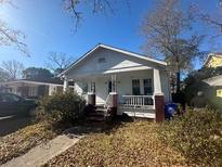 Charming single-Gathering home with a quaint front porch and well-kept lawn at 9 Magnolia Ave, Charleston, SC 29403