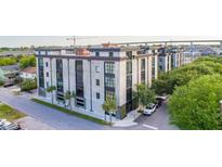 Stunning low-rise condo with a modern facade and meticulously kept landscaping in a desirable neighborhood at 1 Cool Blow St # 153, Charleston, SC 29403