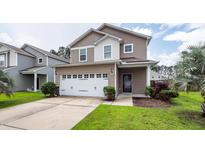 Charming two-story home with a well-maintained lawn, featuring a two car garage and neutral color palette at 107 Brookhaven Rd, Summerville, SC 29486