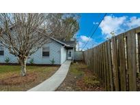 Charming single-story home featuring a well-maintained yard and inviting entryway at 2172 Palermo Pl, North Charleston, SC 29406