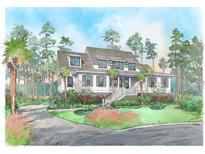Charming two-story home with landscaped yard and covered front porch nestled among mature trees at 1479 Jeremy Cay Ct, Awendaw, SC 29429