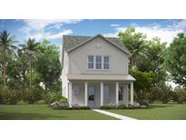 Charming two-story home with a welcoming front porch and well-maintained landscaping at 310 Archar St, Summerville, SC 29486