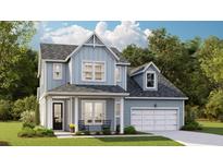 Charming two-story home with light blue siding, a covered porch, and a two-car garage on a well-manicured lawn at 88 French Garden Cir, Summerville, SC 29486