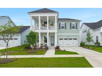 Charming two-story home with inviting front porch, balcony, and manicured lawn at 198 Steepbrook Dr, Summerville, SC 29486