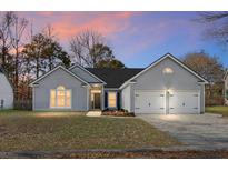Charming single-Gathering home with a two-car garage, manicured lawn, and classic architectural details at 207 Thomaston Ave, Summerville, SC 29485