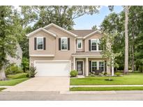 Charming two-story home with manicured lawn, attached two-car garage and welcoming front porch with a bench at 1309 Belgian Draft Dr, Mount Pleasant, SC 29466
