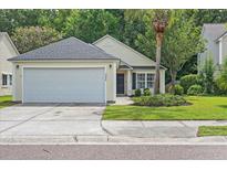 Charming single-Gathering home with a well-maintained front yard and two-car garage at 3486 Ashwycke St, Mount Pleasant, SC 29466
