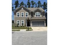 Charming two-story home with a gray two-car garage and well-maintained lawn at 400 Silent Bluff Dr, Summerville, SC 29486