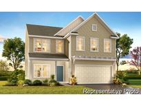 Charming two-story home with a welcoming front porch and manicured lawn at 1009 Marsh Harrier Dr # Cc3-2-2P, Ravenel, SC 29470