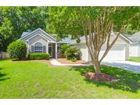 Charming home with manicured front lawn and mature trees at 169 Historic Dr, Mount Pleasant, SC 29464
