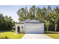 Charming single-story home with a well-manicured lawn and attached garage, surrounded by mature trees at 345 Pine Crest View Dr, Summerville, SC 29486