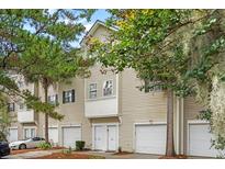 Charming townhome showcasing a two-story facade, private garages, and inviting curb appeal at 4551 Great Oak Dr, North Charleston, SC 29418