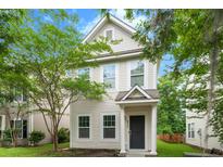 Inviting two-story home featuring classic siding, complemented by lush trees and landscaping at 4938 Ballantine Dr, Summerville, SC 29485