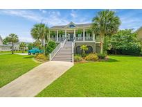 Charming two-story home with a landscaped yard, inviting staircase, and a picturesque view at 544 Two Mile Run, Johns Island, SC 29455