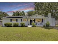 Charming home with a well-manicured front yard and solar panels at 1032 Windward Rd, Charleston, SC 29412