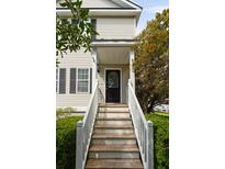 Inviting front entrance featuring a decorative glass door and a well-maintained wooden staircase at 815 Harbor Pl Dr, Charleston, SC 29412