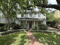 Charming two-story home with a brick walkway and well-manicured landscaping at 1433 Oaklanding Rd, Mount Pleasant, SC 29464