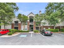 Attractive apartment building with staircase, manicured landscaping, and convenient parking at 2011 N Hwy 17 # 2200H, Mount Pleasant, SC 29466