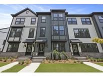 Modern townhome featuring a manicured lawn and stylish architectural details at 205 Somerset Acres Dr, Summerville, SC 29486